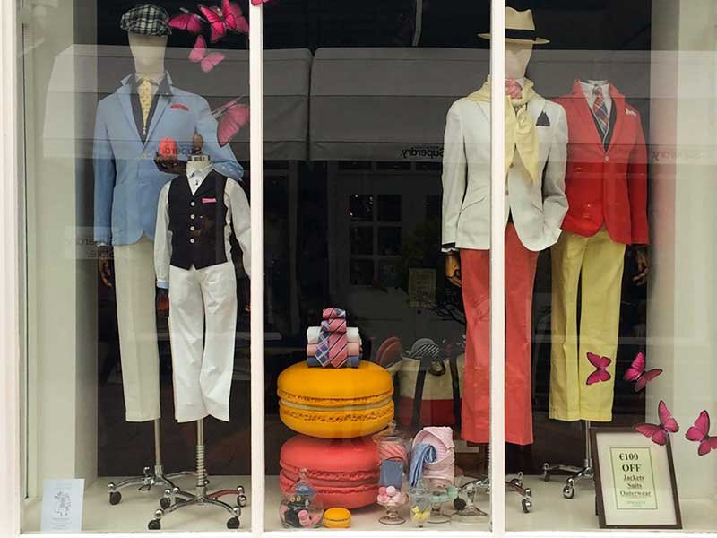 Large bright macaroon props in window display.