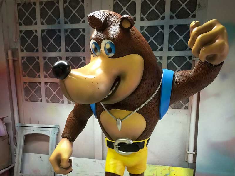 Fibreglass sculpture of banjo game character in workshop.